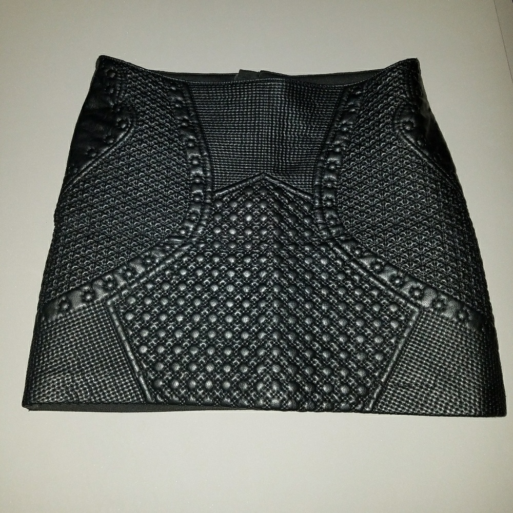 Black leatherette textured mini skirt by H&M. Sz 8